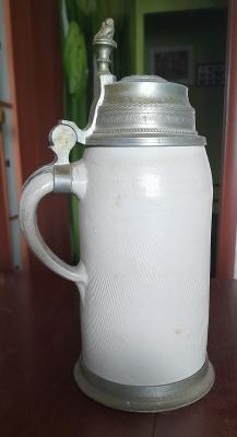 Beer stein with cooing pigeons.