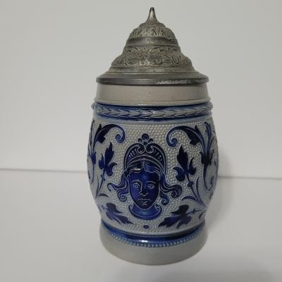 Woman's Head with Floral Scroll