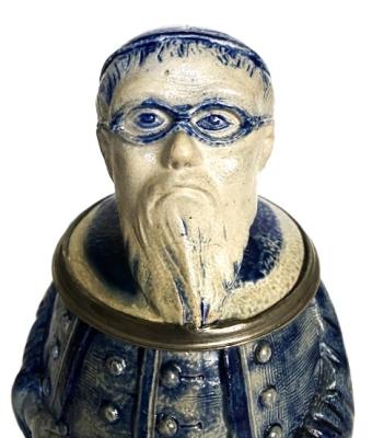 Monk with beard and glasses